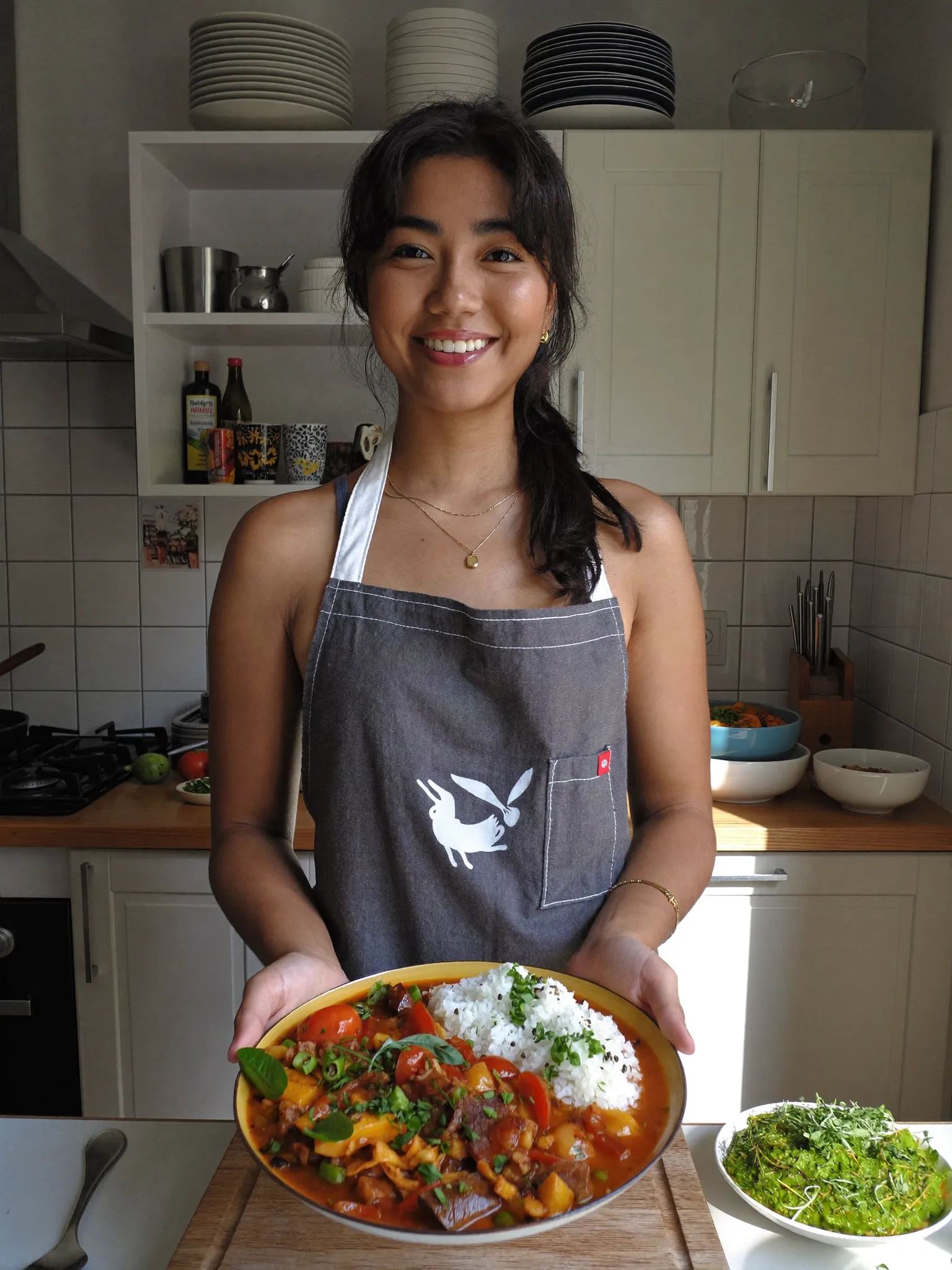 Sample food creator presenting a cooked dish