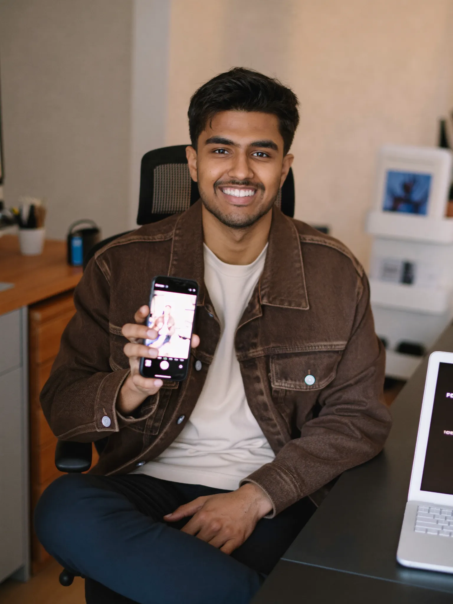 Sample tech creator filming with a phone